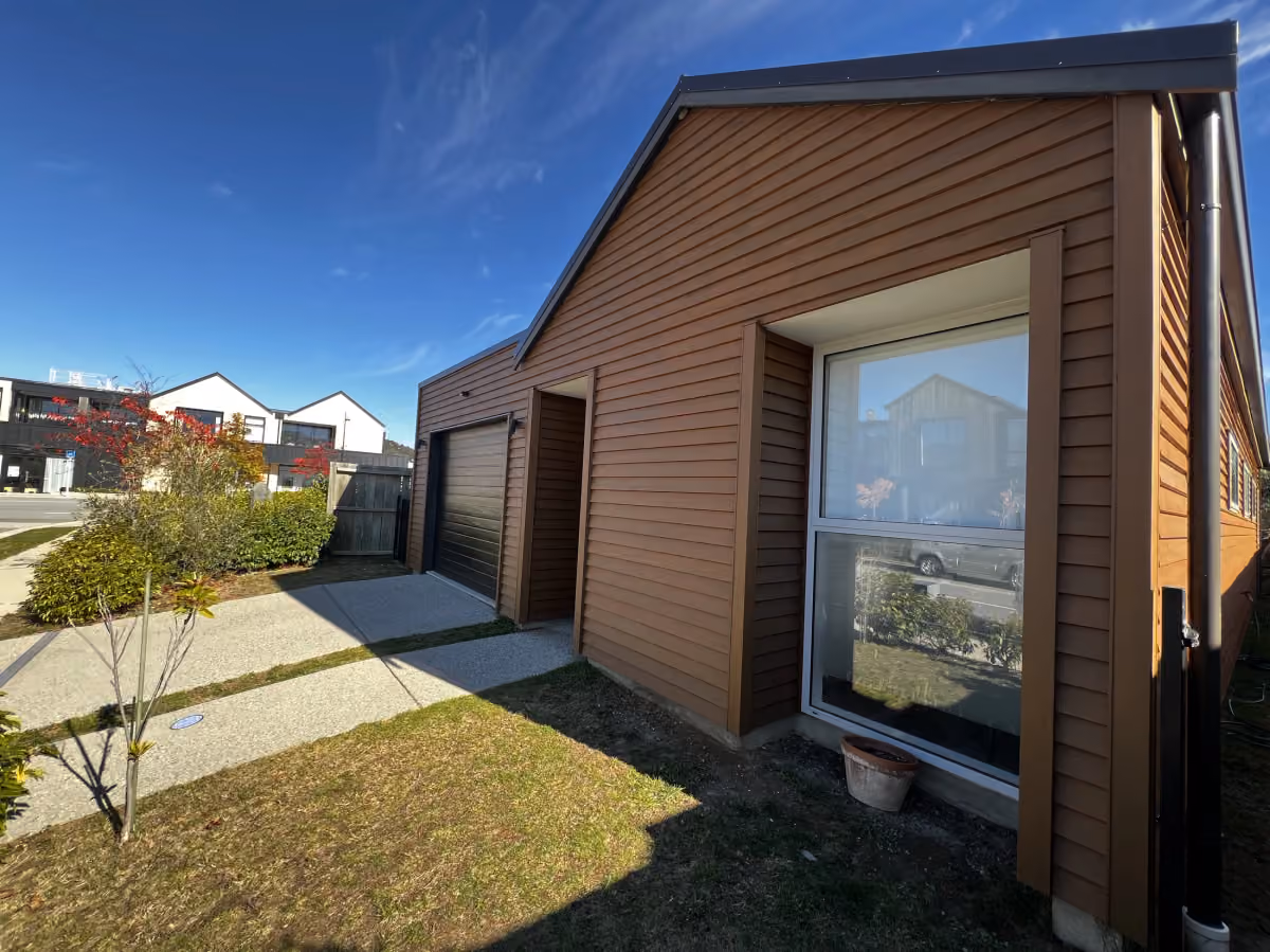 Restored cedar cladding on a Wānaka home, photographed by Lakeside Painting